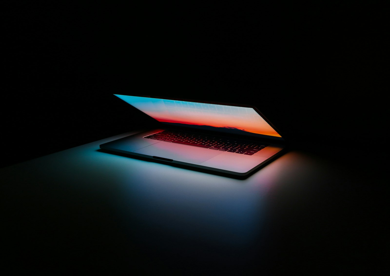 Laptop computer on a dark surface